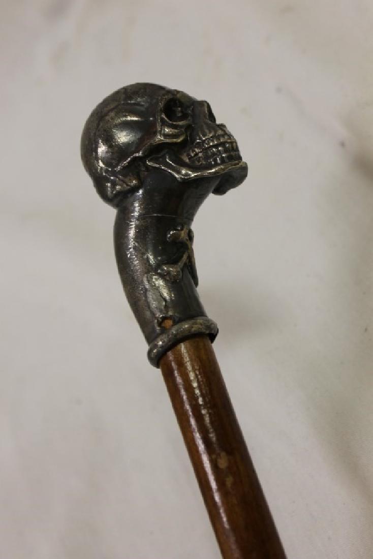 36 1/2" cane with metal skull and crossbones handle. Dec 31, 2016