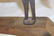 Mounted sheet iron horse on wooden base, with strap at - 4