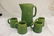 Acorn marked stonware tankard with 4 mugs with moled