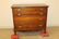 Walnut 4-drawer inlaid chest with scalloped apron and