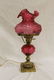 Fenton cranberry table lamp with molded rose font and