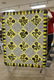 Quilt with black and yellow Morning Glory type flowers,