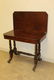 Carved mahogany game table with finely carved base with