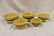 Set of (5) graduated yellow ware mixing bowls.
