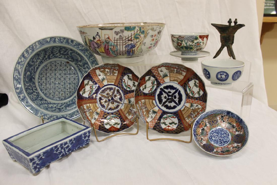 Grouping of Oriental porcelain: 7 1/2" X 5 1/2" blue: Grouping of Oriental porcelain: 7 1/2" X 5 1/2" blue and white footed planter, unmarked; 4 3/4' X 2 1/2" bowl with blue and white windows; 5 7/8" shallow bowl with cobalt and gold decoration with base