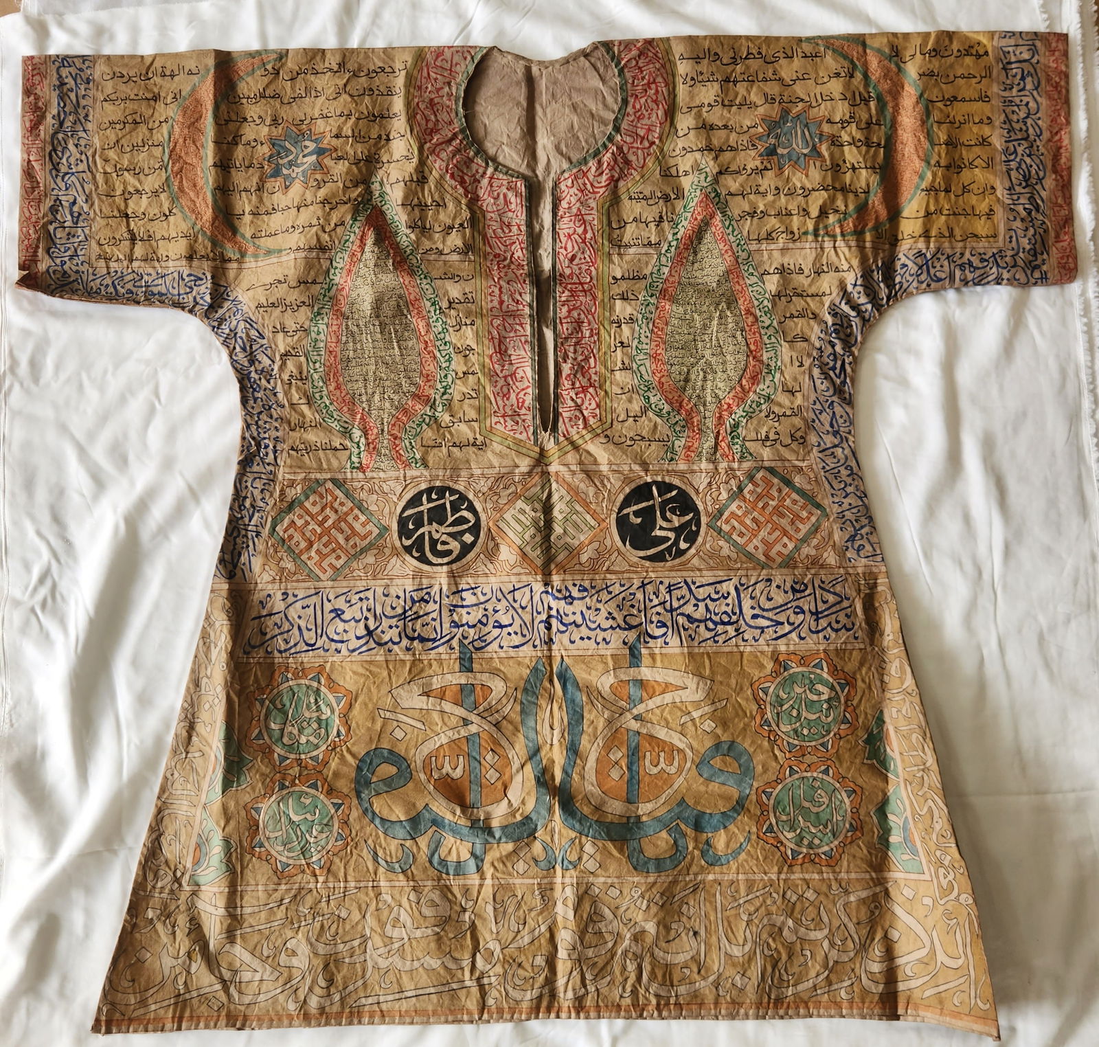 Rare islamic ottoman hamdmade Talismanic shirt (jama) covered with handwritten text both side: Rare islamic ottoman hamdmade Talismanic shirt (jama) covered with handwritten text both sides ( front and back) in Naskh and Thuluth scripts, in assorted colors, arranged in numerous panels, roundels