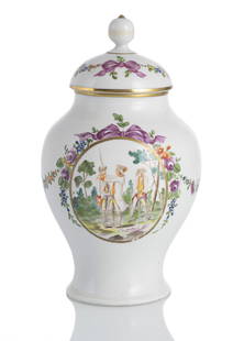 BALUSTRE SHAPED VASE AND COVER: BALUSTRE SHAPED VASE AND COVERVolkstedt, circa 1770/80H. 23 cmMilitary scenes on both sides in a medallion with flower garlands, mark: crossed sticks in underglaze blue. The lid replaced, 20th