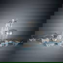 A SIX PIECE SILVER AND GLASS VANITY SET