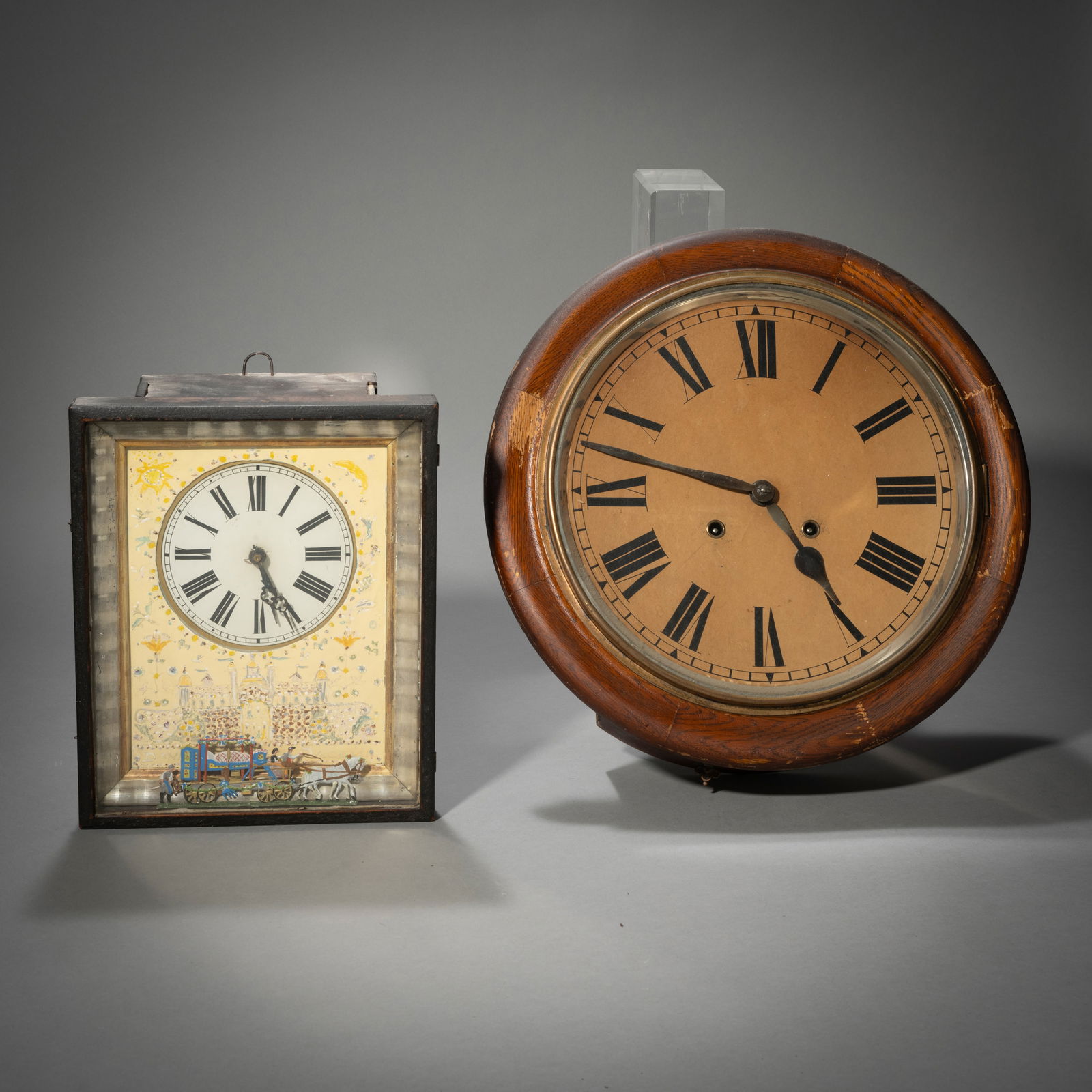 TWO WALL CLOCKS: TWO WALL CLOCKSBlack Forest/EnglandD. 39/30 x 25 cmWooden case. One with battery-run movement. Rest. Age damage, functionality not guaranteed.Zwei Rahmen-UhrenSchwarzwald/EnglandD. 39/30 x 25 cmHolzge