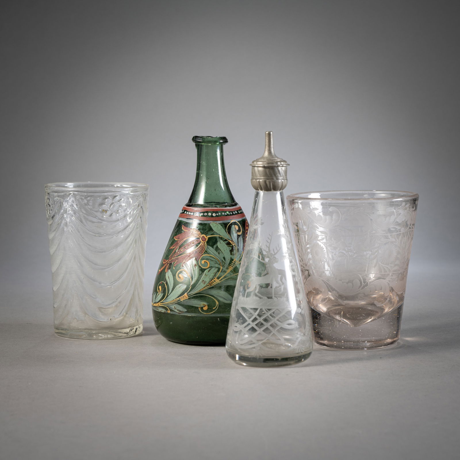 TWO BEAKER, A BABY'S BOTTLE AND A PAINTED BOTTLE: TWO BEAKER, A BABY'S BOTTLE AND A PAINTED BOTTLE18th/19th centuryH. 11,5/16 cmPainted bottle with minute chips. Cut glass, one beaker of pressed glass.Zwei Becher, Kinderflasche und emaillebemalte Fla