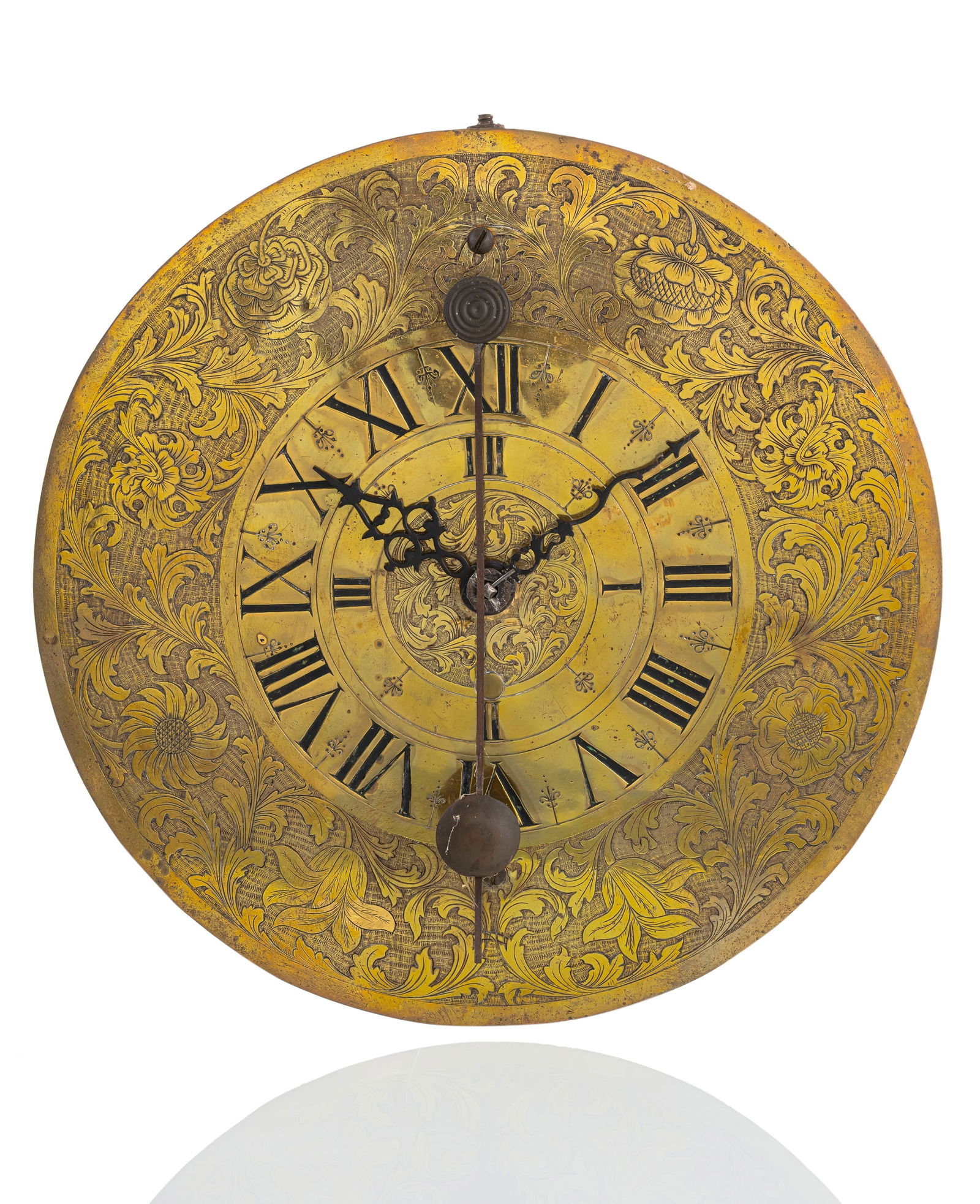 A BAROQUE WALL CLOCK: A BAROQUE WALL CLOCKprobably South Germany, 18th centuryH. 31,5 cmRound, engraved brass dial with Roman numerals and decorated hands and small front pendulum. Iron case with side doors, iron/brass ver
