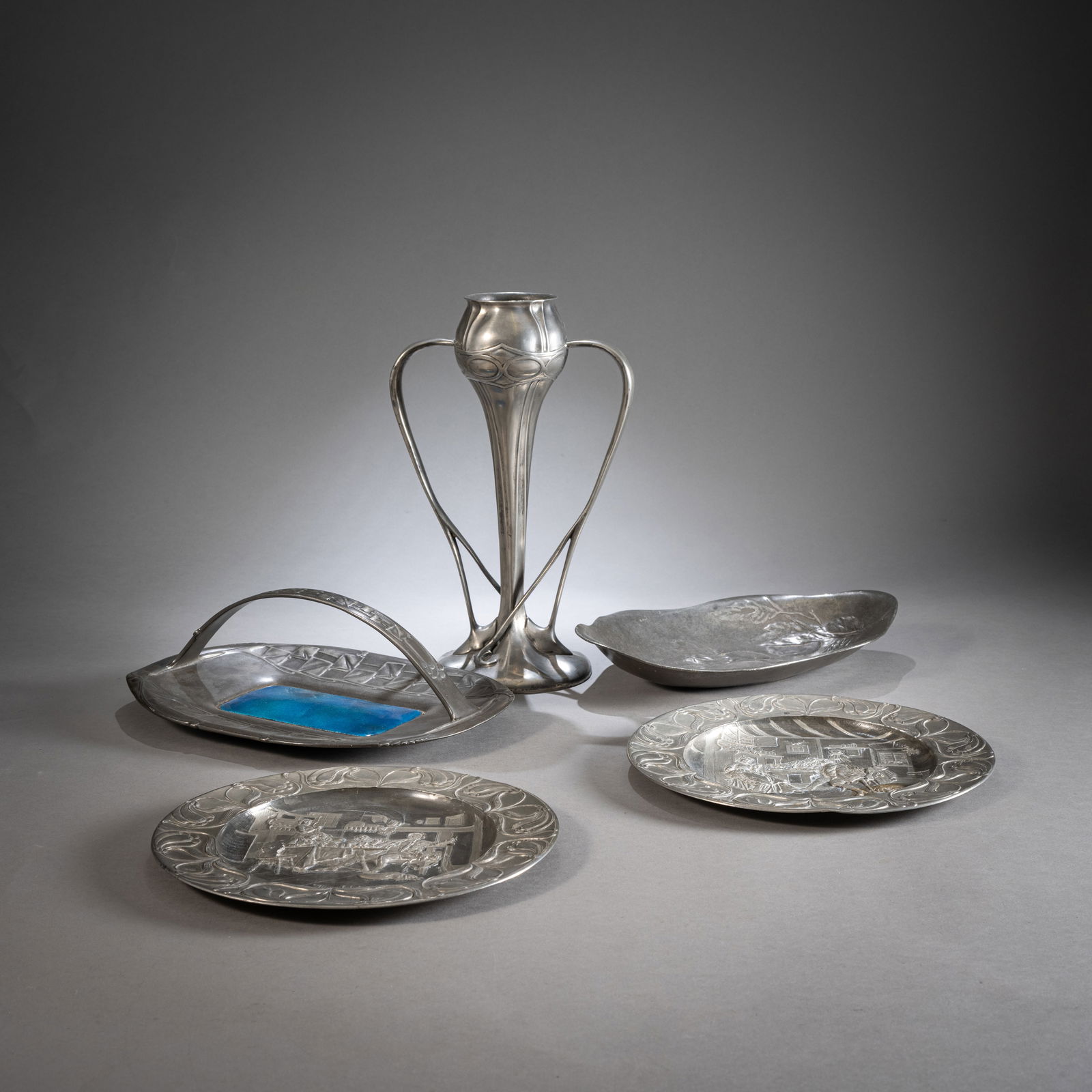 A MIXED LOT OF ART NOUVEAU PEWTER ITEMS - A HANDLED DISH, A DISH, TWO PLATES AND A VASE (1 of 3)