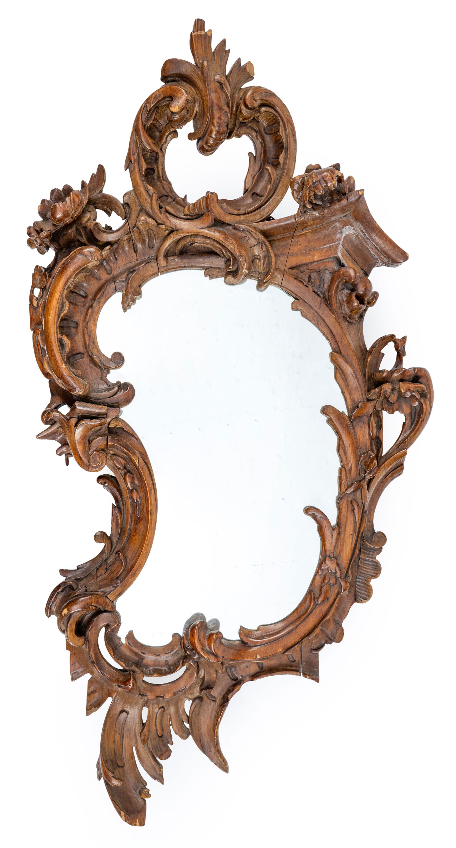 A CARTOUCHE SHAPED CARVED AND BROWN GLAZED MIRROR: A CARTOUCHE SHAPED CARVED AND BROWN GLAZED MIRROR 19th century 105 x 55 cm Of Baroque style. Losses, damages due to age, rest., new mirror glassPrunkvoller Spiegel im Rokoko-Stil in Kartuschenform