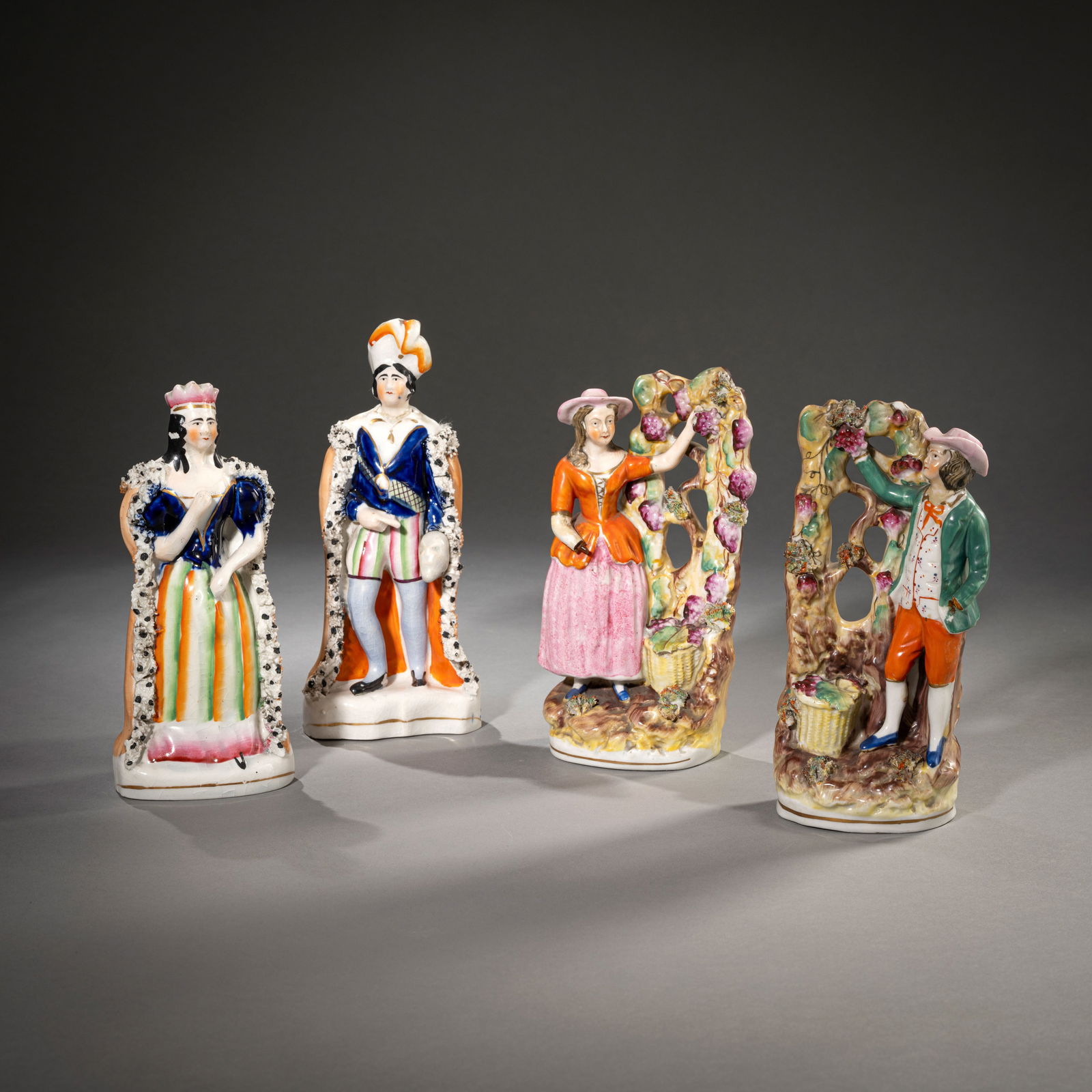 FOUR ENGLISH STONEWARE FIGURES: FOUR ENGLISH STONEWARE FIGURES 19th century H. 19/20,5 cm Polychrome painted.Vier Steingut-Figuren England, 19. Jh. H. 19/20,5 cm Steingut, bemalt.