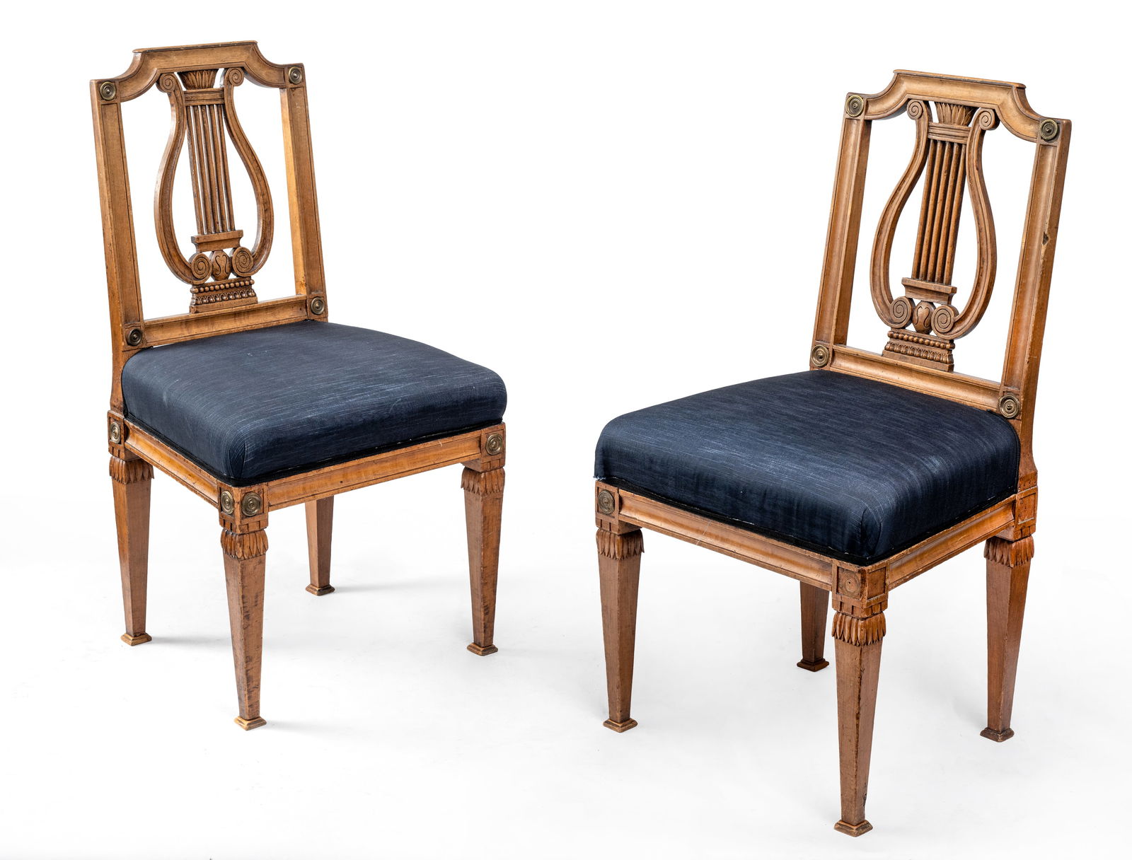 A PAIR OF NEOCLASSICAL FRUITWOOD CHAIRS: A PAIR OF NEOCLASSICAL FRUITWOOD CHAIRS early 19th century H. 92 cm The openworked seatback with Lyra motif, black fabric liner. Rest., damages due to age.Paar klassizistische Stühle mit