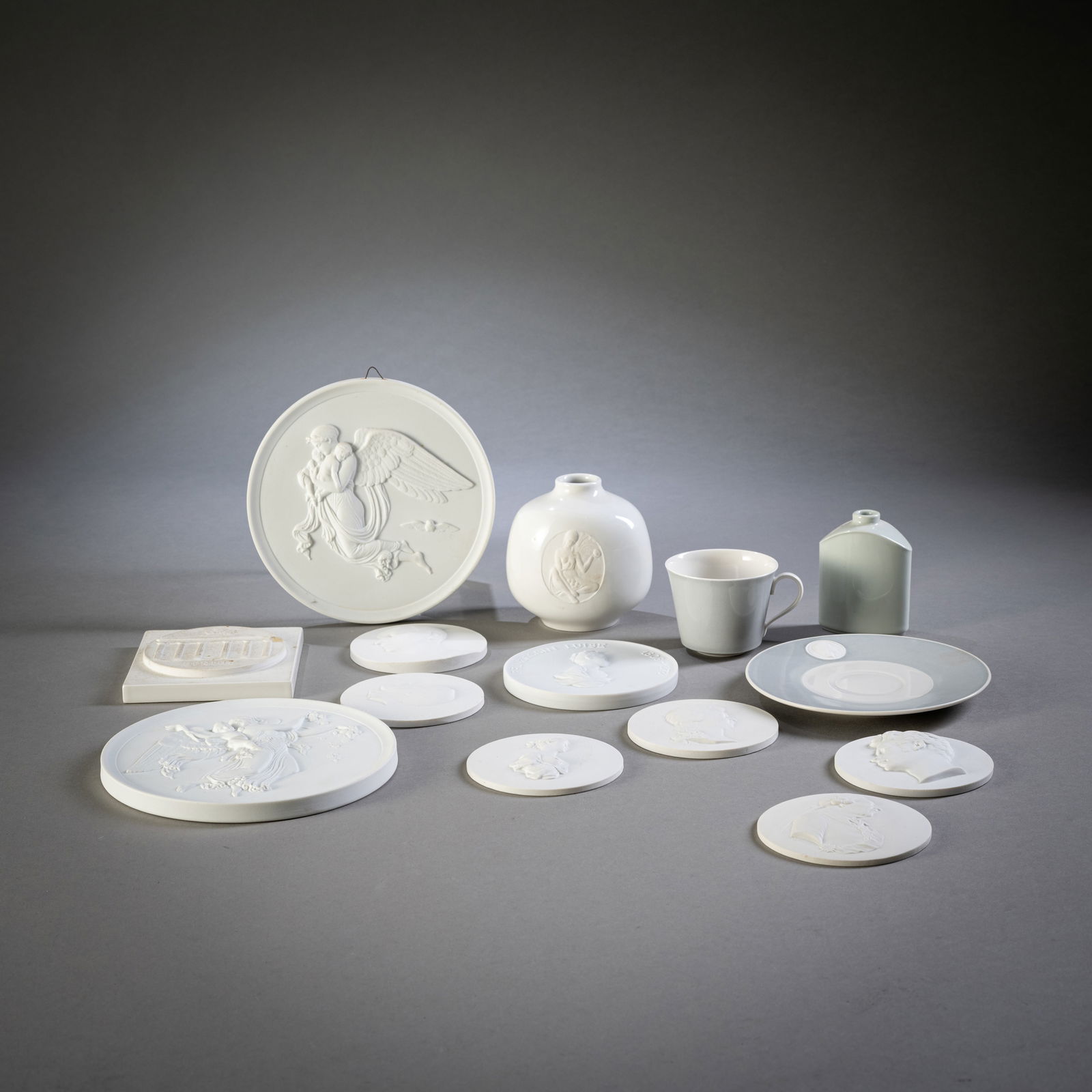 MIXED BISQUE PORCELAIN: MIXED BISQUE PORCELAIN Berlin/ Meissen and others, 20th century. divers 2 small vases, a cup with saucer, 6 plaques with portraits of historical personalities, such as Frederick the Great, 1 plaque