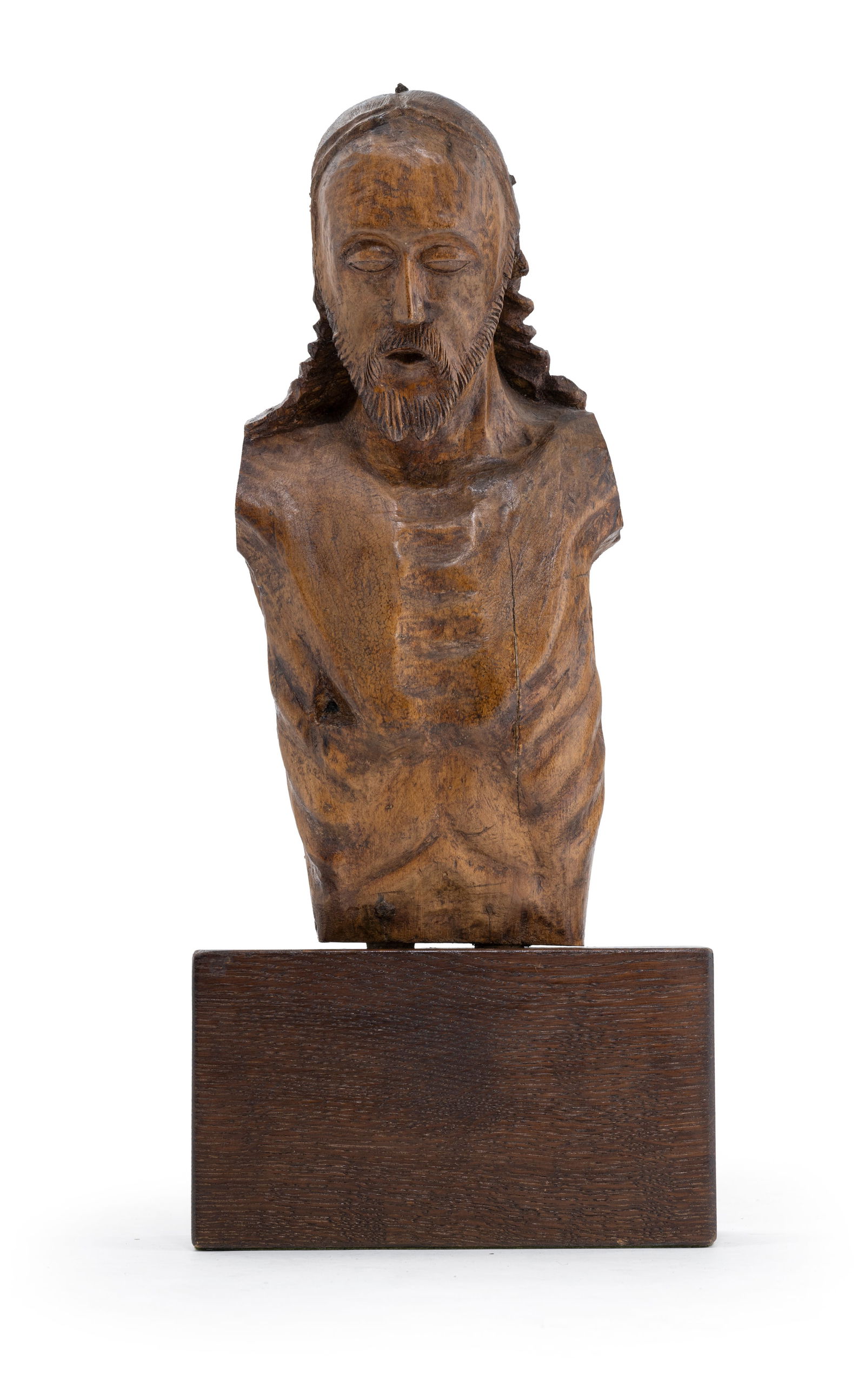 A BUST OF CHRIST: A BUST OF CHRIST 15th/19th century (?) H. 39/53 cm Hardwood. A fragment. Polychromy removed and dark stained. Modern stand. Rest., damages due to age.Christus-Büste 15./19. Jahrhundert (?) H.