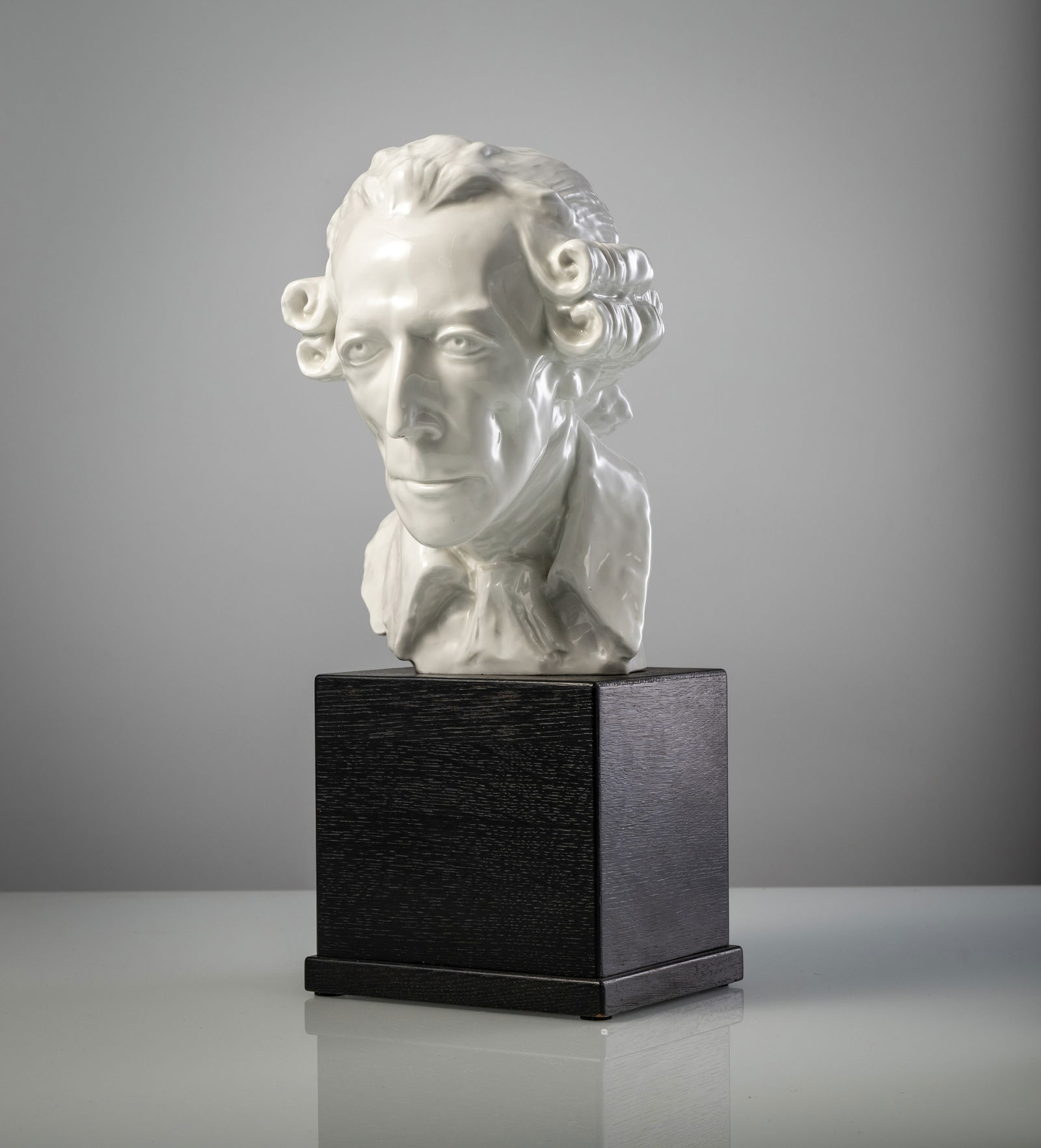 THE BUST OF KING FREDERIC II OF PRUSSIA: THE BUST OF KING FREDERIC II OF PRUSSIA Meissen, 2nd half 20th century H. 30/49 cm Design from 1927 by Wolfgang Kronsbein. Incised sword mark, blue sword mark (1st choice), model no. 1199, incised