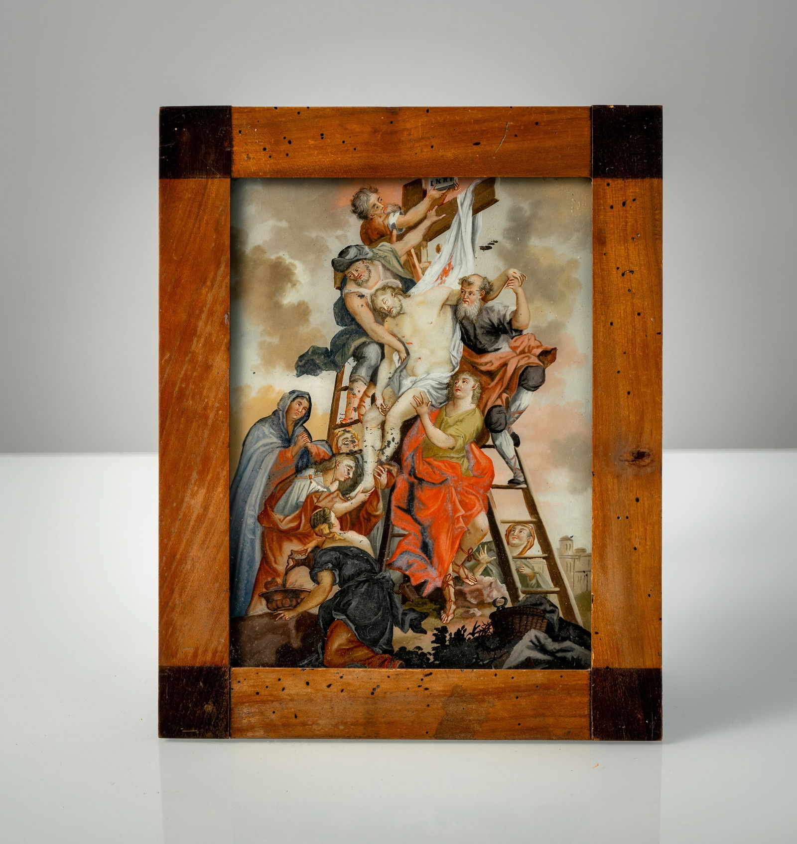 A GLASS PAINTING ON REVERSE - DEPOSITION FROM THE CROSS: A GLASS PAINTING ON REVERSE - DEPOSITION FROM THE CROSS South German or Swiss, 2nd half 18th century 25 x 18,5 cm/31 x 25 cm, R. Multi-figure scene in front of a suggested city wall. Rubbed. Later