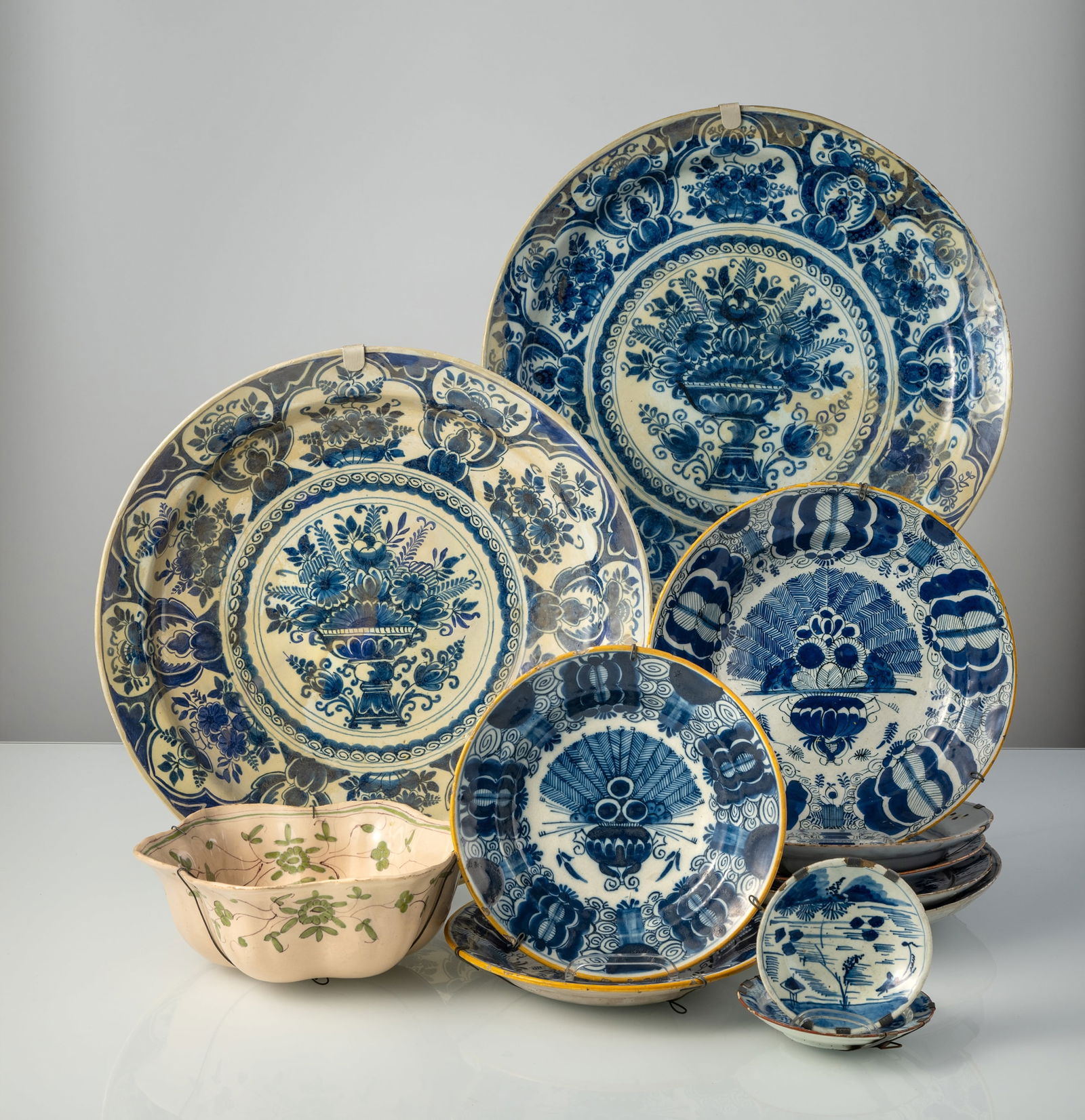 A MIXED LOT OF TWELFE FAIENCE PLATES DISHES AND BOWLS (1 of 5)