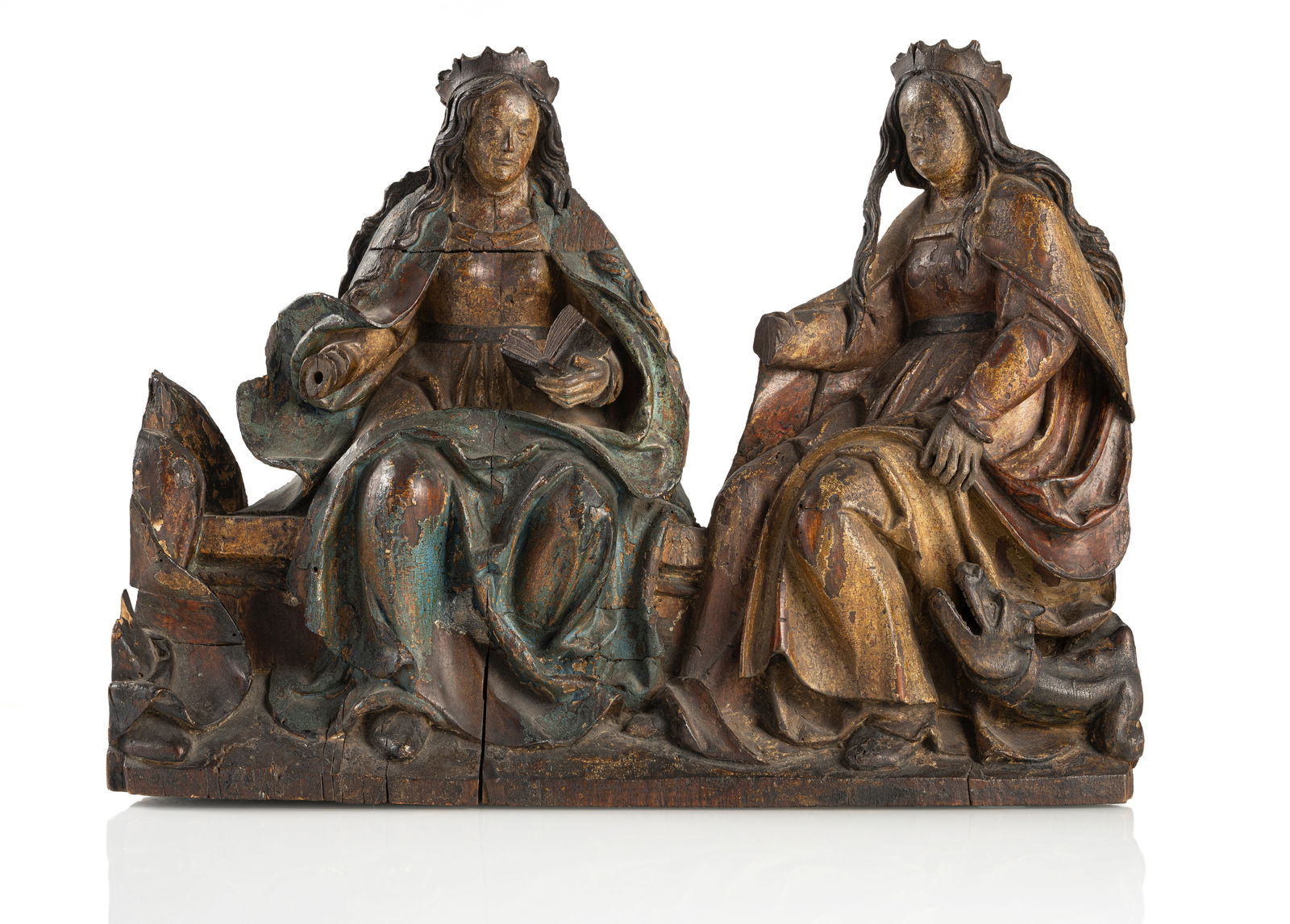 A RELIEF CARVING OF TWO FEMAILE SAINTS: A RELIEF CARVING OF TWO FEMAILE SAINTS Passau/Lower Bavaria, ca. 1520 42 x 56 cm From a predella relief. Saint Margaret with the dragon and a Saint with a book. Hardwood, probably limewood, carved in