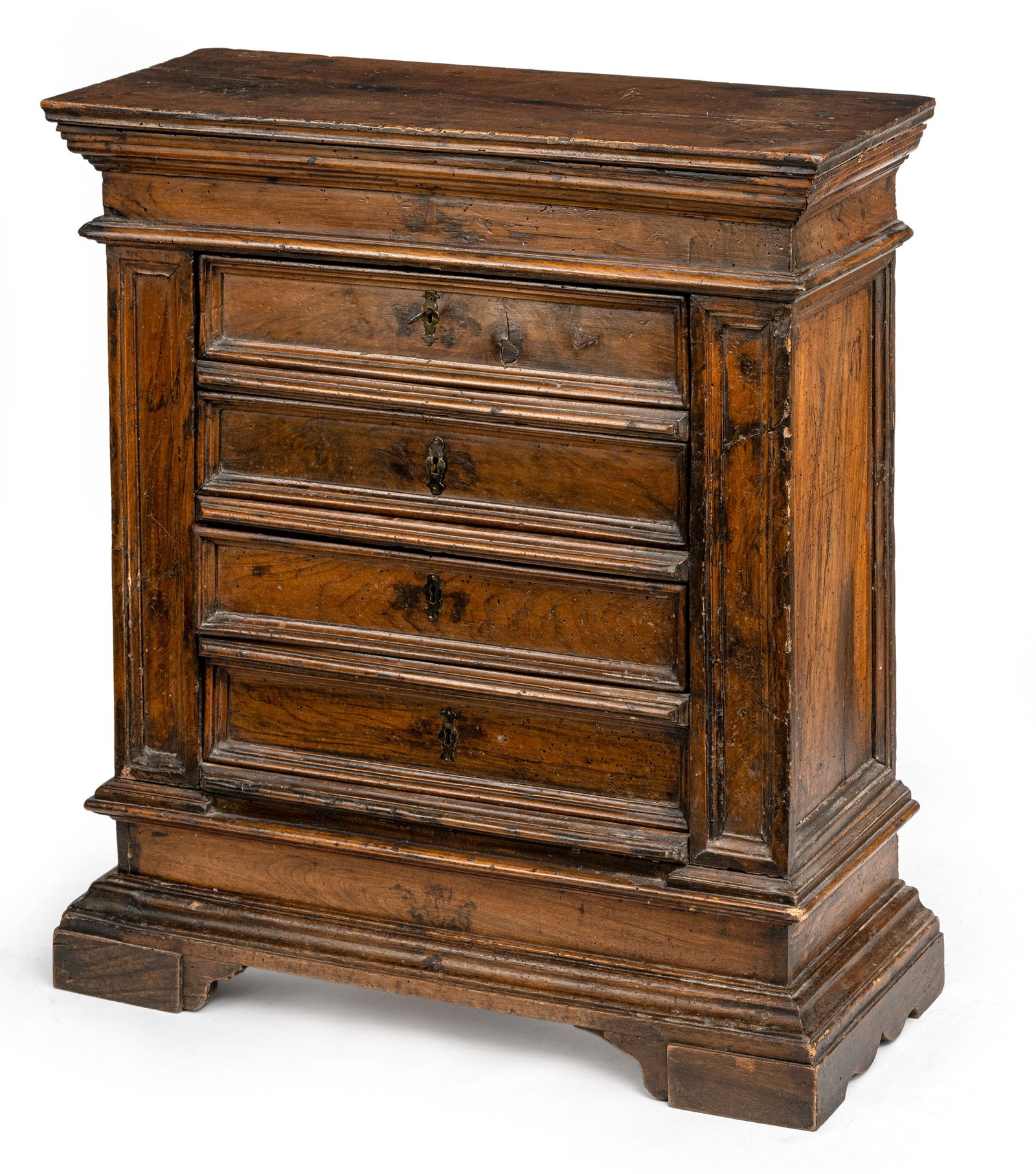 A NORTH ITALIAN BAROQUE WALNUT COMMODE: A NORTH ITALIAN BAROQUE WALNUT COMMODE 17th/18th century 87 x 80 x 31,5 cm With 4 drawers and profiled and shaped edges and base. Damages due to age, restorations, additions.Anrichte/Kommode