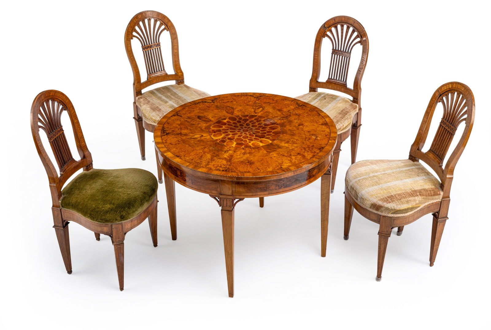 A NEOCLASSICAL WALNUT CENTRE TABLE AND FOUR CHAIRS: A NEOCLASSICAL WALNUT CENTRE TABLE AND FOUR CHAIRS 19th century H. 71/D. 89 cm, H. 93 cm The round top with central "oyster" parquetry, the chairs with openworked backrests. Losses, restorations,
