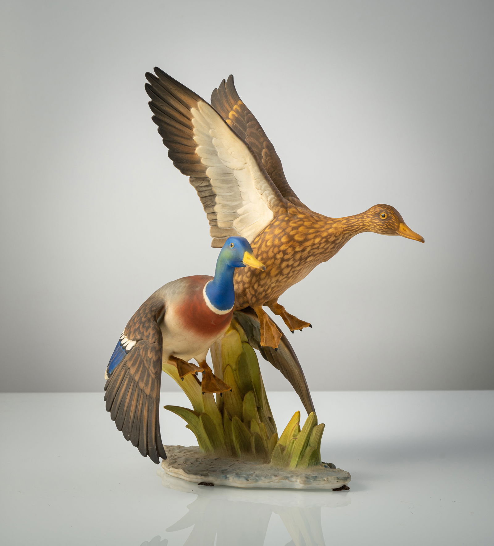 A PAIR OF DUCKS: A PAIR OF DUCKS Hutschenreuther, Selb, 20th century H. 38 cm Designed by Hans Achtziger (1918-2003), marked at the bottom, manufactory stamp mark and "Kunstabteilung". Painted biscuit porcelain, min.