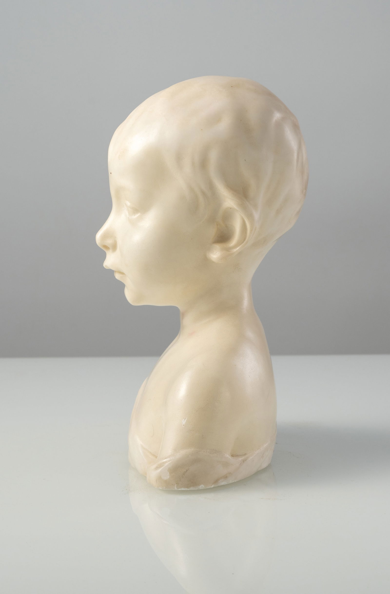 A WHITE MARBLE BUST OF A BOY - 2
