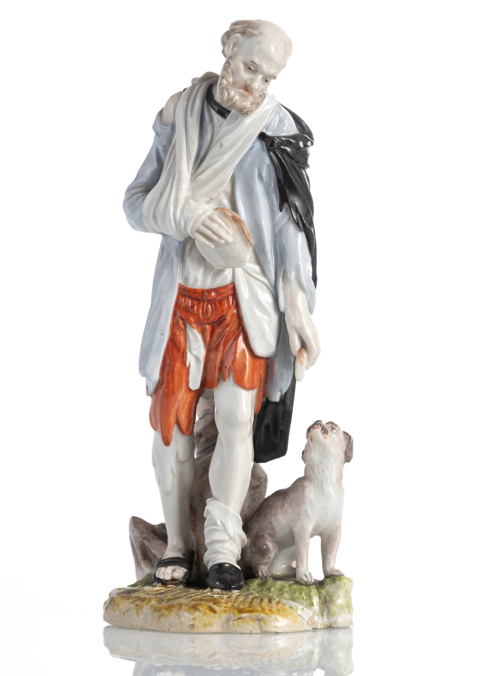A LUDWIGSBURG FIGURE OF A BEGGAR WITH DOG: A LUDWIGSBURG FIGURE OF A BEGGAR WITH DOG 1662/72 circa H. 15,8 cm The model by Johann J. Louis, blue crowned CC mark and old sticker. The stand restored, chipped. Old private collection, Stuttgart