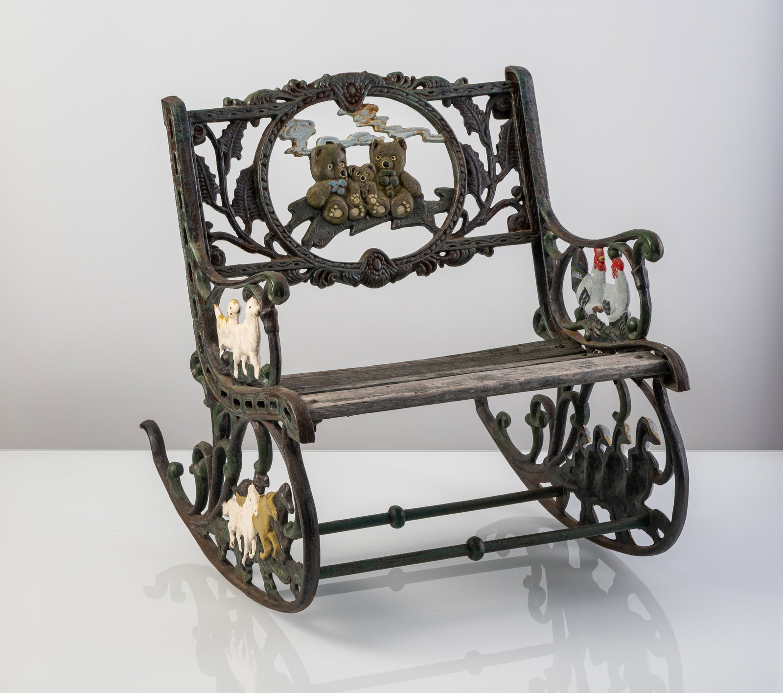 A CAST IRON KIDS' ROCKING CHAIR - 2
