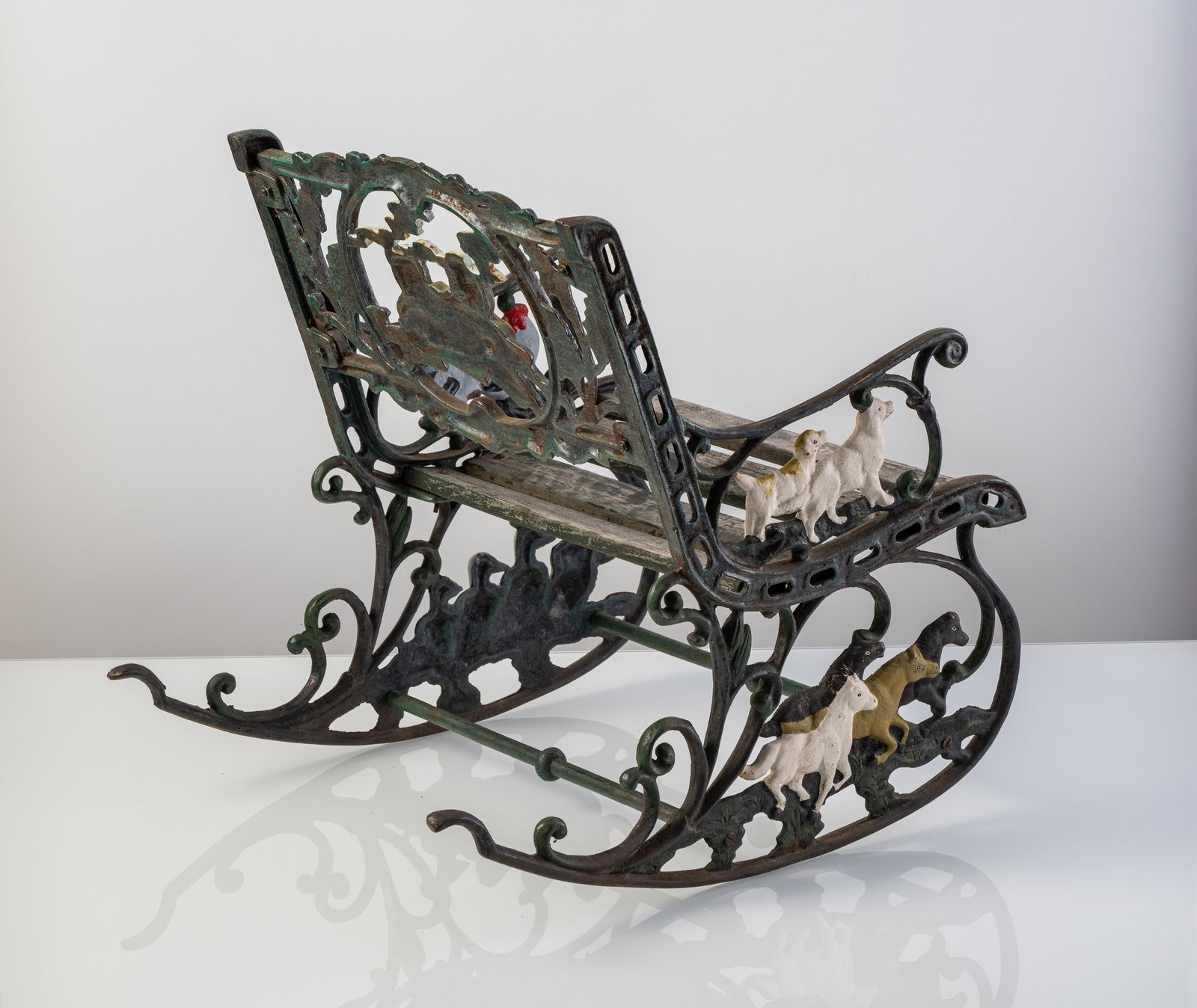 A CAST IRON KIDS' ROCKING CHAIR - 3