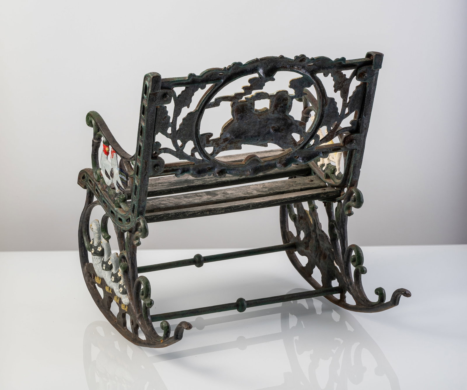 A CAST IRON KIDS' ROCKING CHAIR - 4