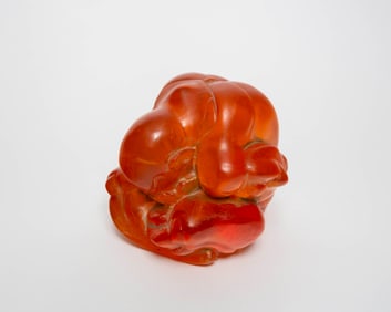 Orange resin Chinese statue