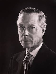Duke of Windsor: In this 1947 portrait by Philippe Halsman, the Duke of Windsor—formerly King Edward VIII—is rendered in stark elegance against a dark, unadorned background. His expression is stern, composed, and