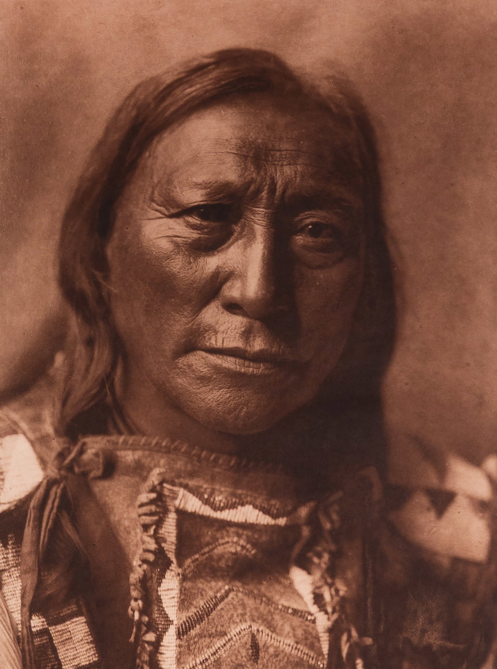 Hollow Horn Bear: This powerful portrait by Edward Curtis depicts Hollow Horn Bear, a prominent Oglala Lakota leader and respected diplomat, taken around 1907. Shown in full regalia, Hollow Horn Bear gazes directly int