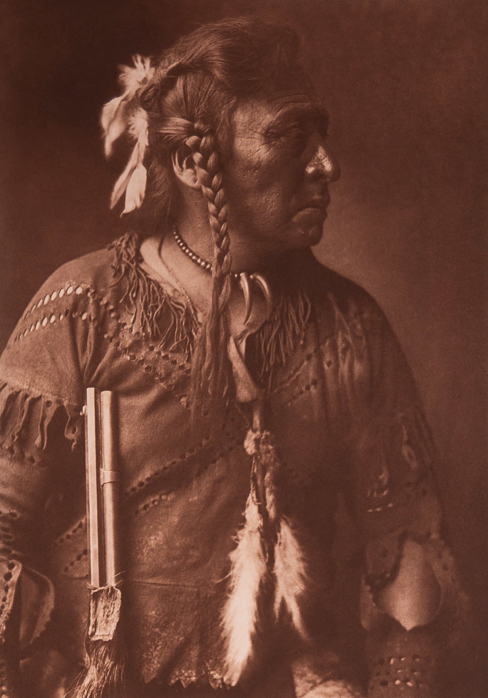 Horse Capture - Atsina: A striking portrait of Horse Capture, an Atsina man, shown in profile with braided hair and wrapped in a robe. His name—evoking strength and prestige—is matched by his calm, resolute expression an