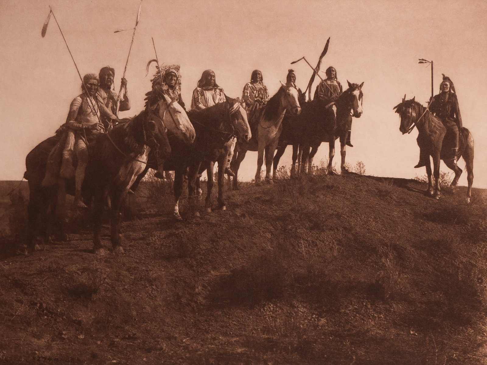 Watching for the Signal - Apsaroke: A dramatic and cinematic scene of an Apsaroke warrior on horseback, silhouetted atop a ridge as he scans the horizon. With wind-tossed hair, upright posture, and a rifle at his side, the figure embodi