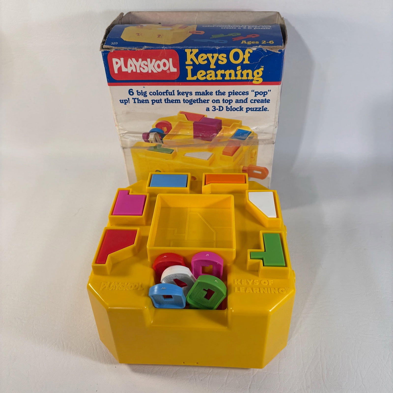 1980s Playskool Keys of Learning, Child Development Puzzle Toy: Missing orange key, which is possible to find a replacement for.