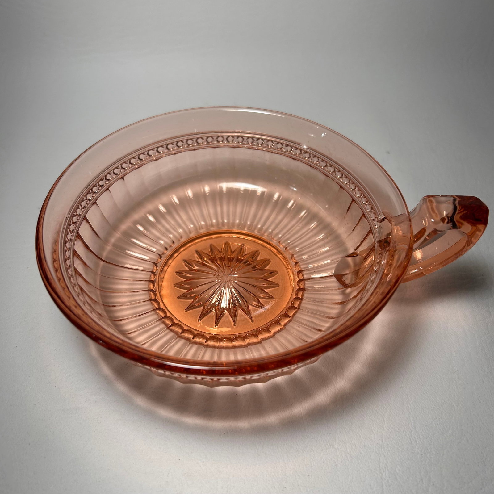 Imperial Glass Co Pink Depression Glass Bowl with Single Squared Handle: W6.25in H2in D5.25in