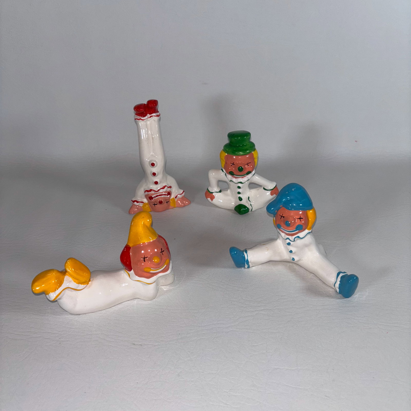 Set of 4 Cute Colorful Clowns: Red, Yellow, Green, and Blue: Group of 4 together: W7in. H5in D5.5in