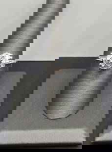 4 Carat Diamond Solitaire Platinum Ring: 4 carat center stone, brilliant solitaire, with trillions on the sides. Size 7.5, weighs 5.3 grams
