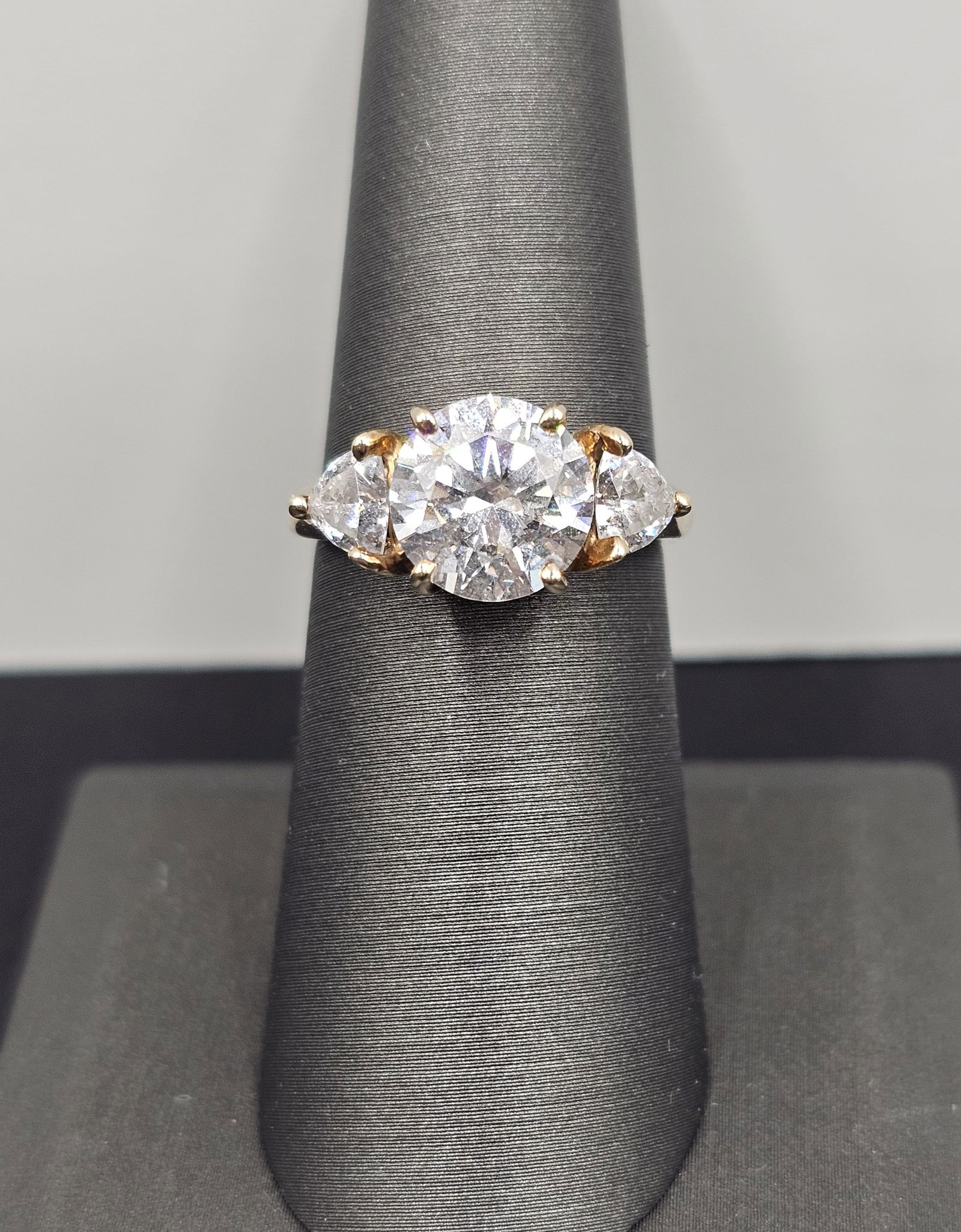 Beautiful Solitaire Ring with Trillions: Size 6, clear stones. Sparkles very well