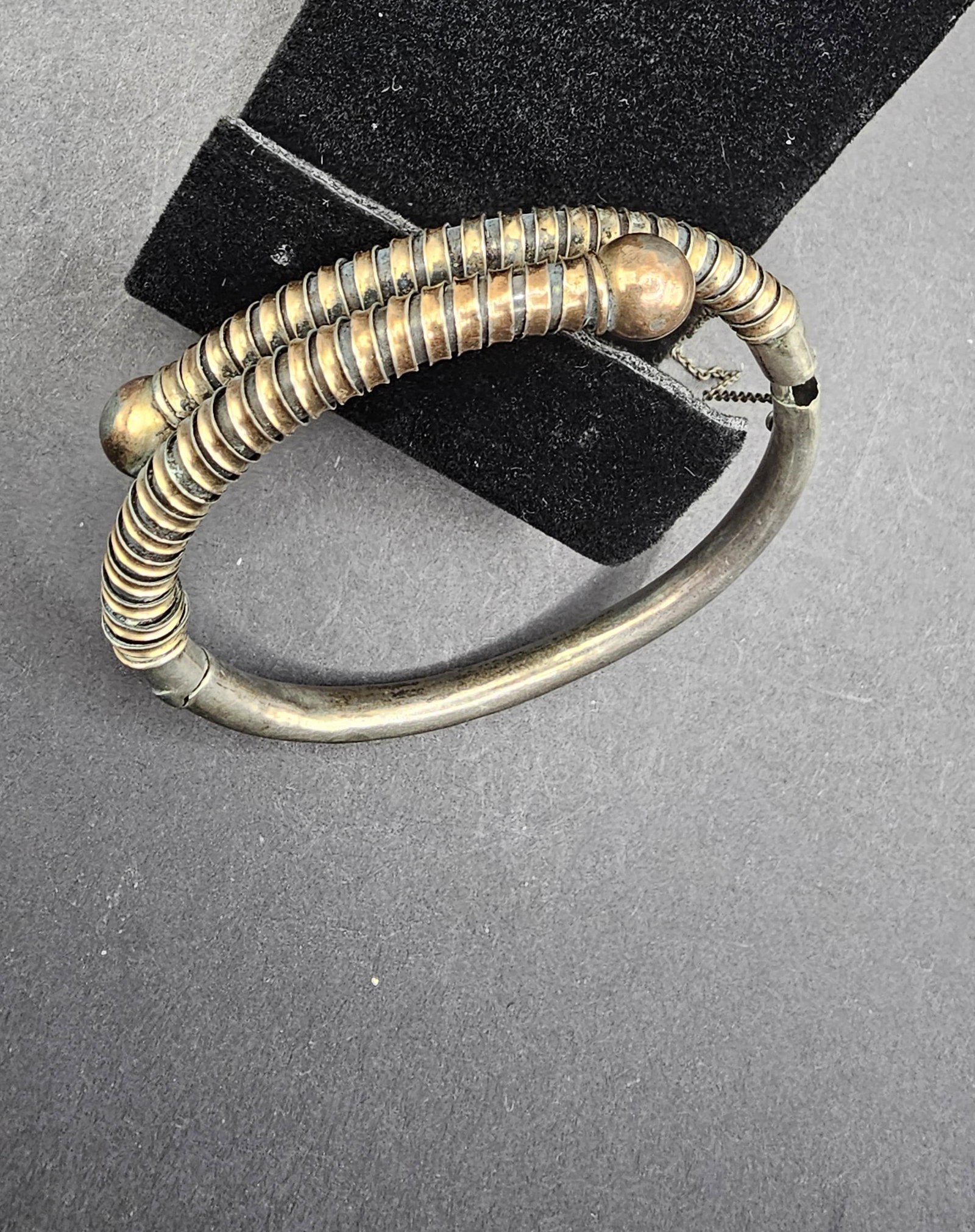 Silver and Possibly Gold Bangle Bracelet with Safety Catch: 12.96 grams