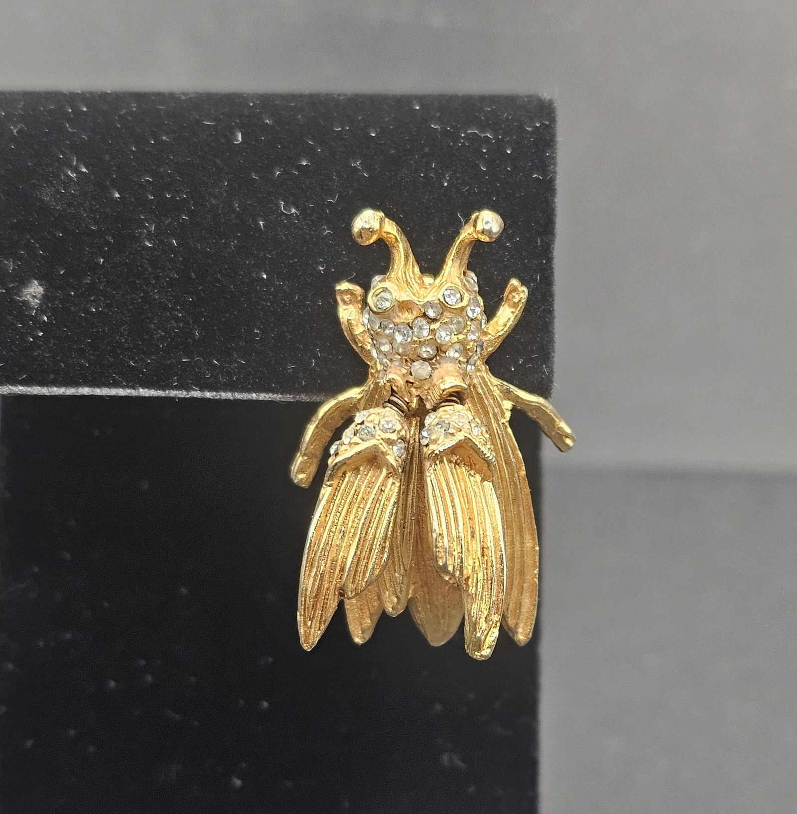 Vintage Hattie Carnegie Tremblant Brooch: Signed, Vintage Gold Plated Metal Alloy, Rhinestone, and Wings that Flutter, 1 1/4” x 7/8”, missing stones