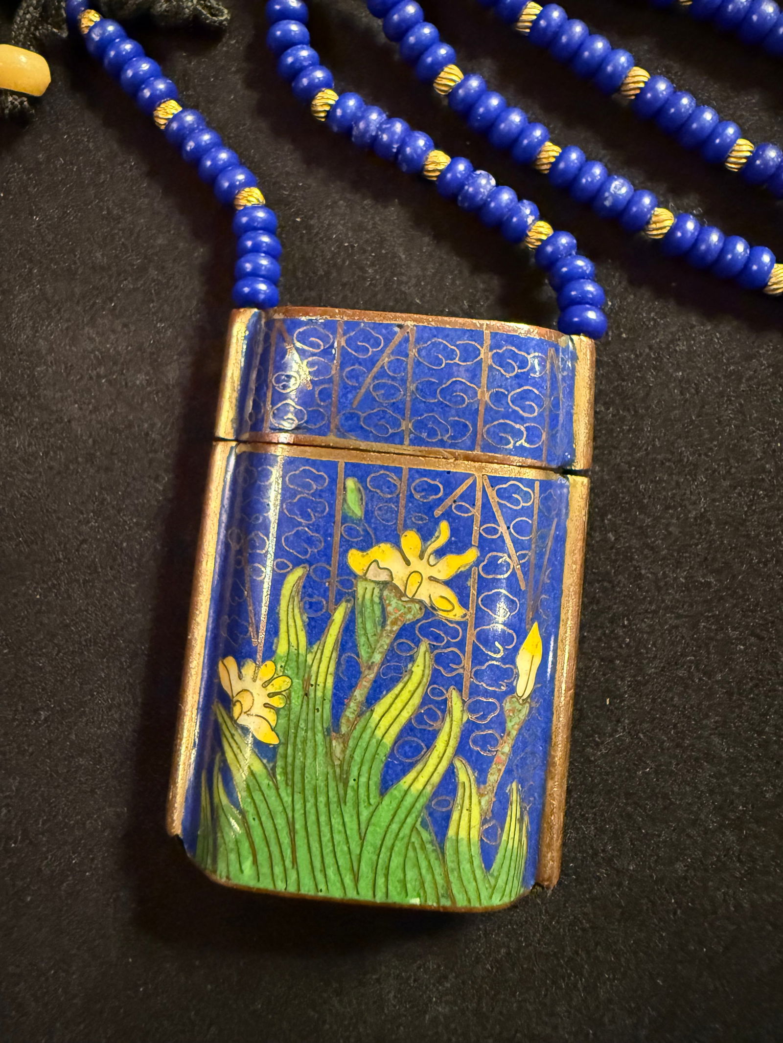 Japanese Cloisonné Inro Box on Lapis Beaded Chain: Japanese Cloisonne Inro Box on Lapis Lazuli and Gold Bead Chain. Enamels are applied by hand onto a copper base. The box has detachable top and comes suspended from a cord. Box measures 2” x 1