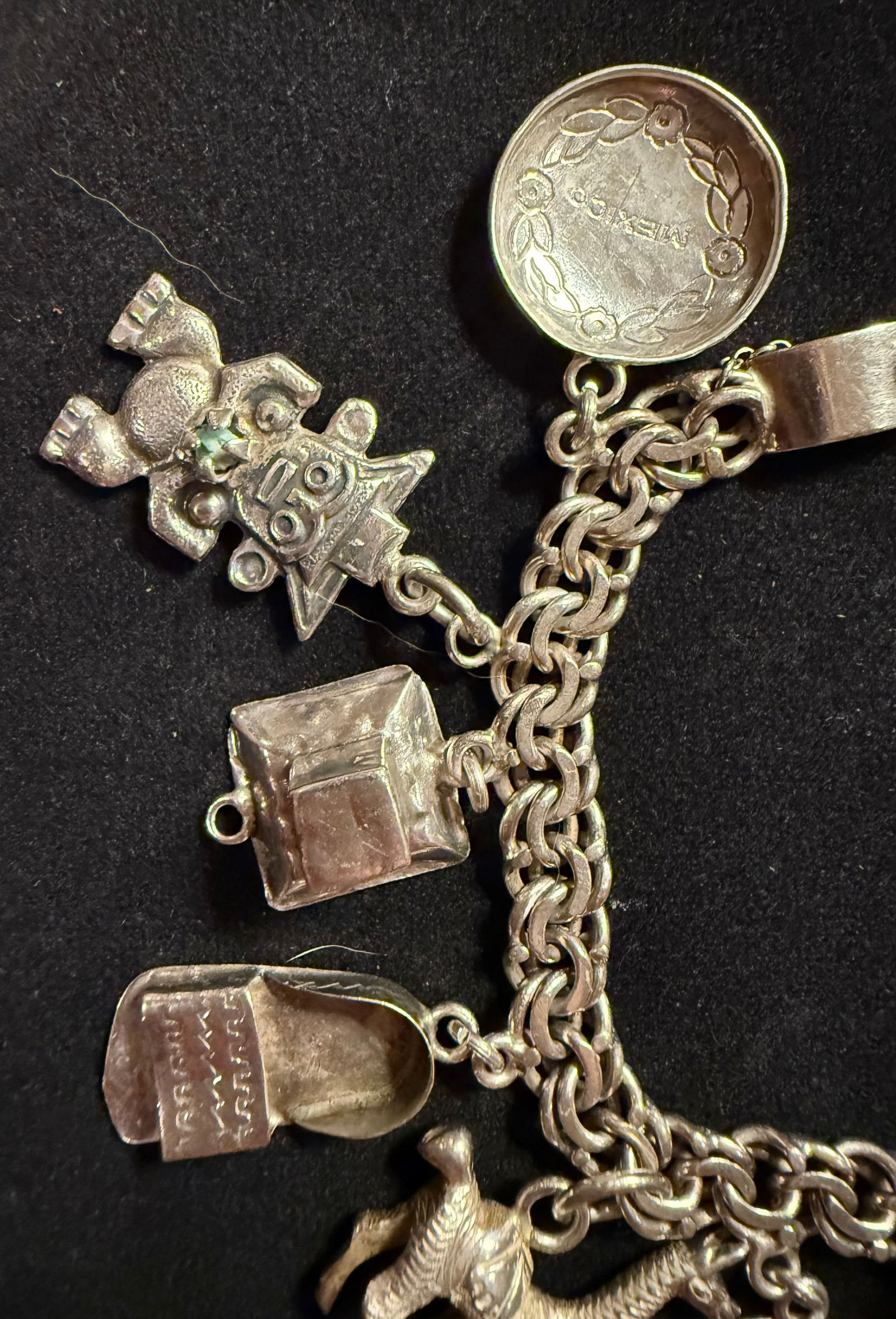 925 Silver Charm Bracelet has 12 charms (See photos) (1 of 3)