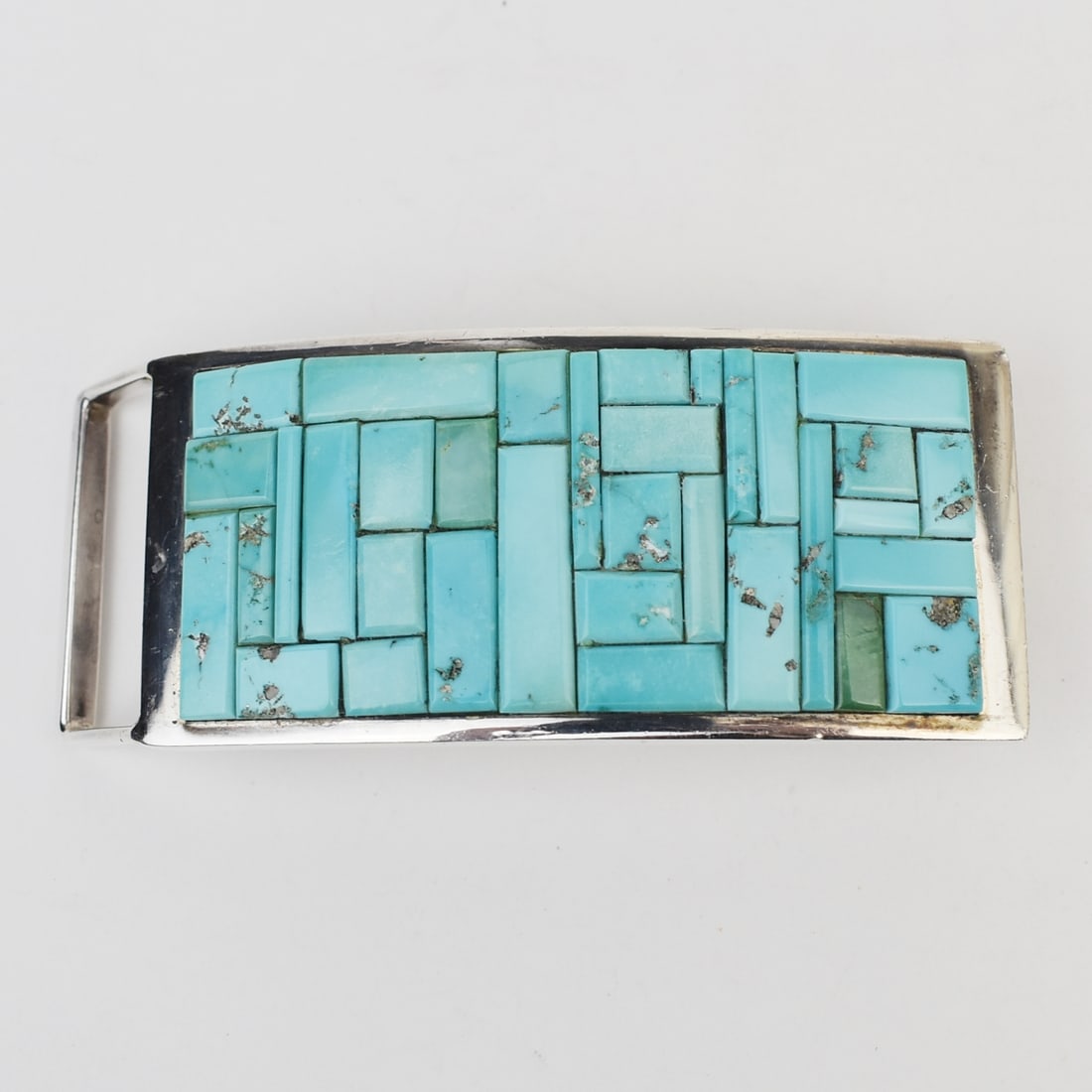 Hanson "Moogie" Smith (Navajo) Silver & Turquoise Inlay Buckle: Beautiful cobblestone inlay buckle with various shades of light blue turquoise by Hanson "Moogie" Smith (Navajo). Smith is known for his attention to detail, which is evident in this piece. HALLMARKS: