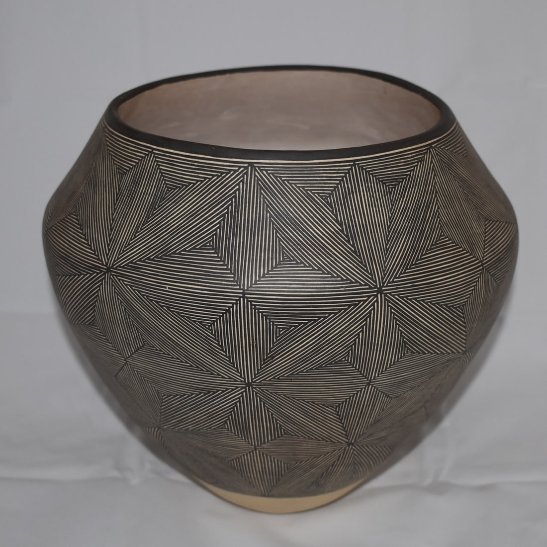 SARAH GARCIA (ACOMA) FINELINE POT: Sarah Garcia (Acoma) larger vessel with very nice painting, symmetry and mellow visual appearance regarding the contrast between black and white. Born and raised at Laguna, Garcia married Jesse Garcia
