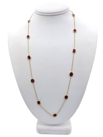 Oval Cut Bezel Set Ruby Station Necklace in 14 Karat Yellow Gold